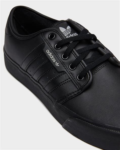 solid black adidas shoes